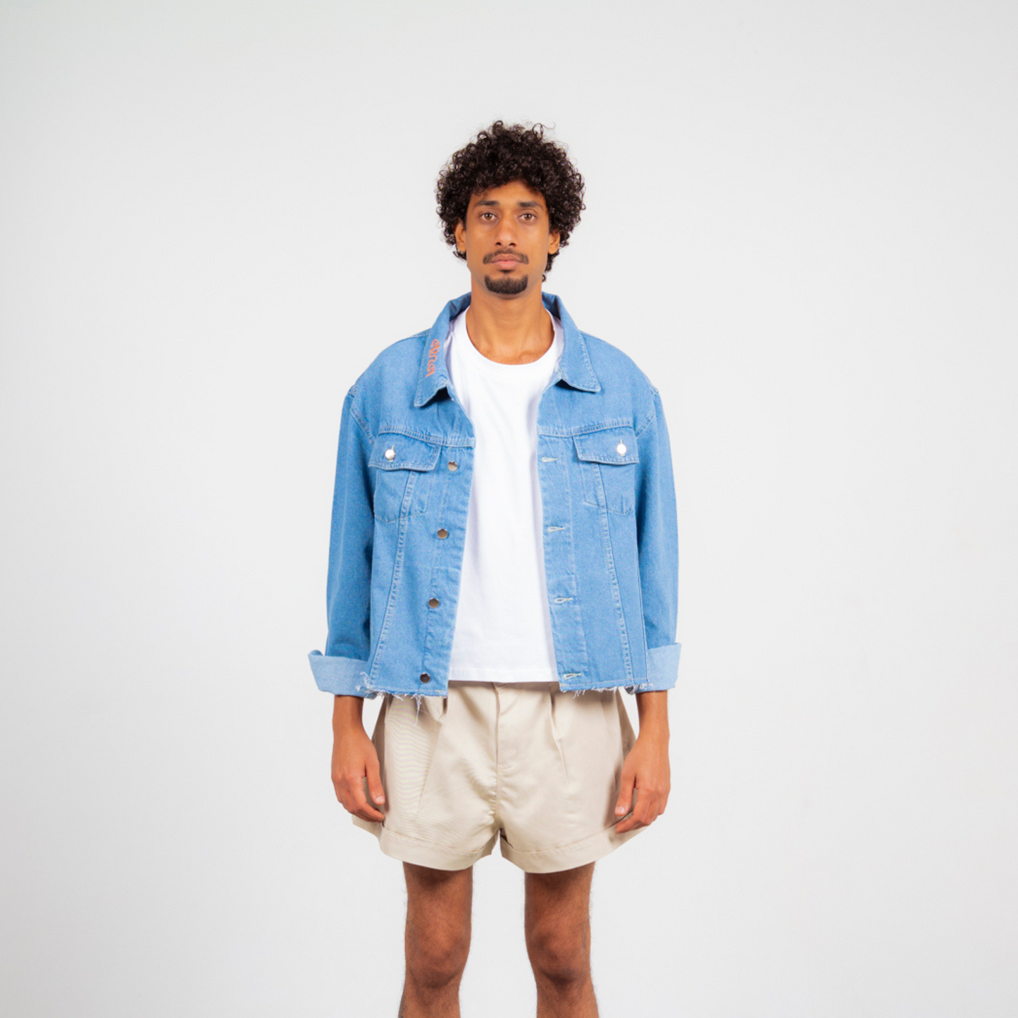 ANA CAI oversized unisex denim jacket in 100% cotton with dropped shoulders, relaxed fit, and classic indigo wash