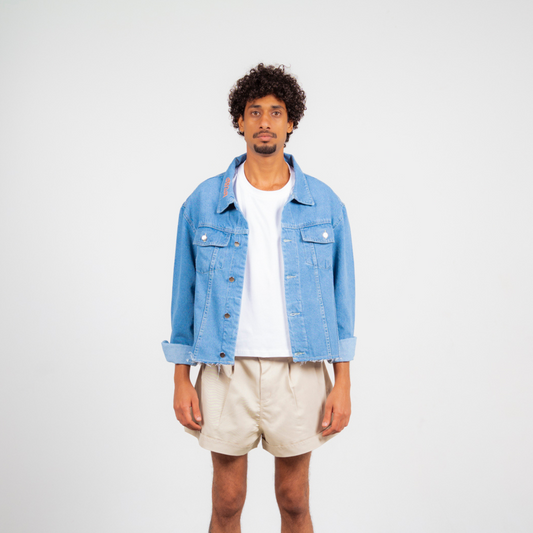 ANA CAI oversized unisex denim jacket in 100% cotton with dropped shoulders, relaxed fit, and classic indigo wash